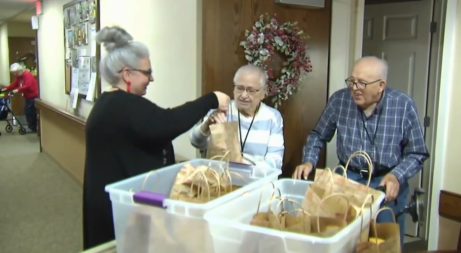 Adams serves residents meals