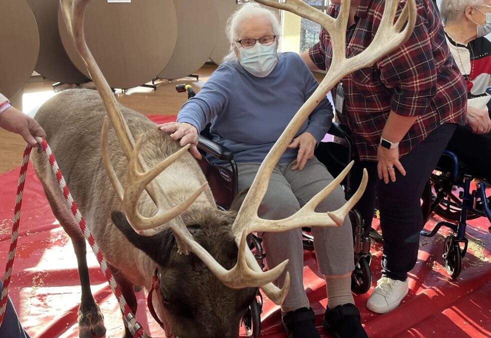 resident with reindeer at event