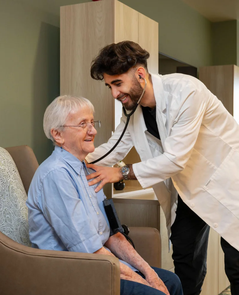 Care giver treating resident